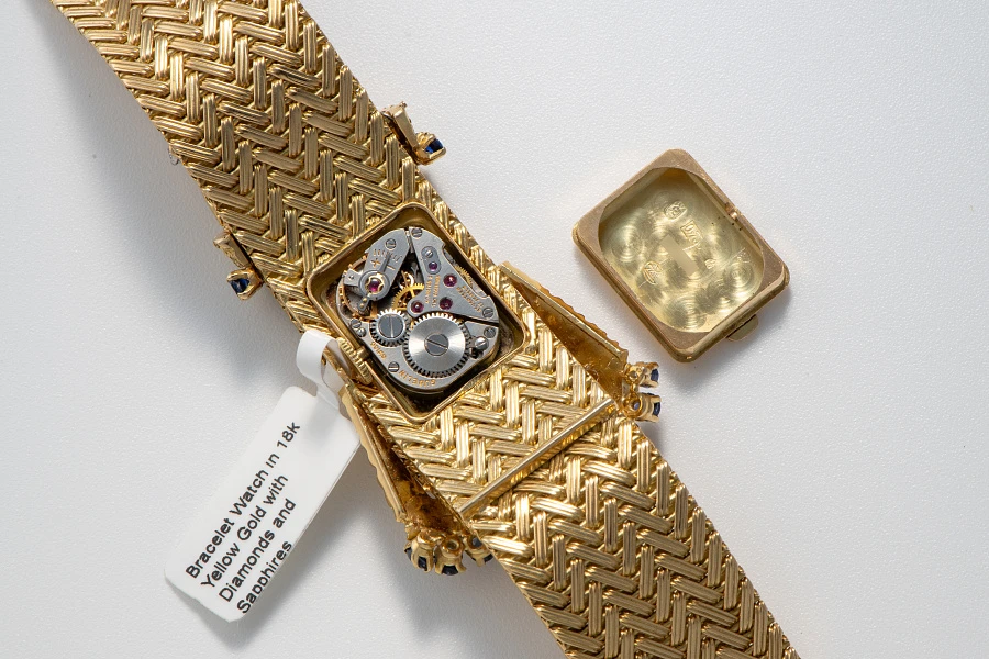 Bracelet Watch in 18k Yellow Gold with Diamonds and Sapphires